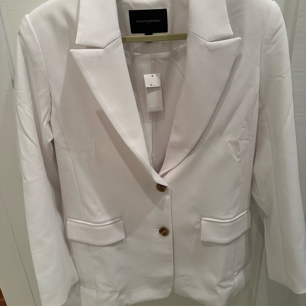 Never worn. White blazer
